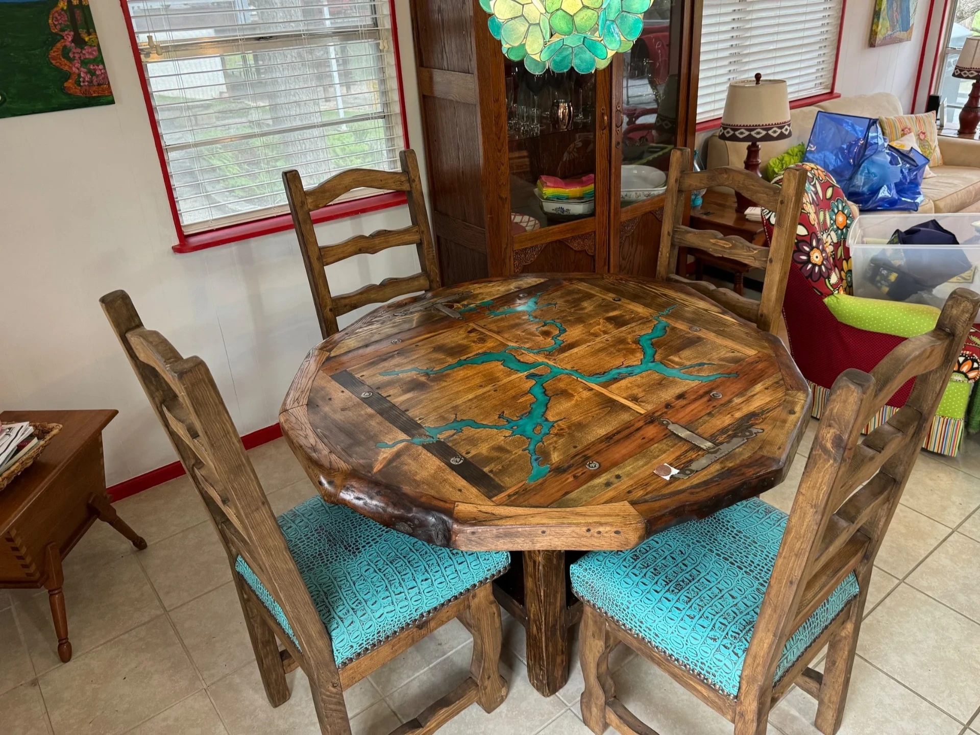Round reclaimed wood dining table with white stone inlay