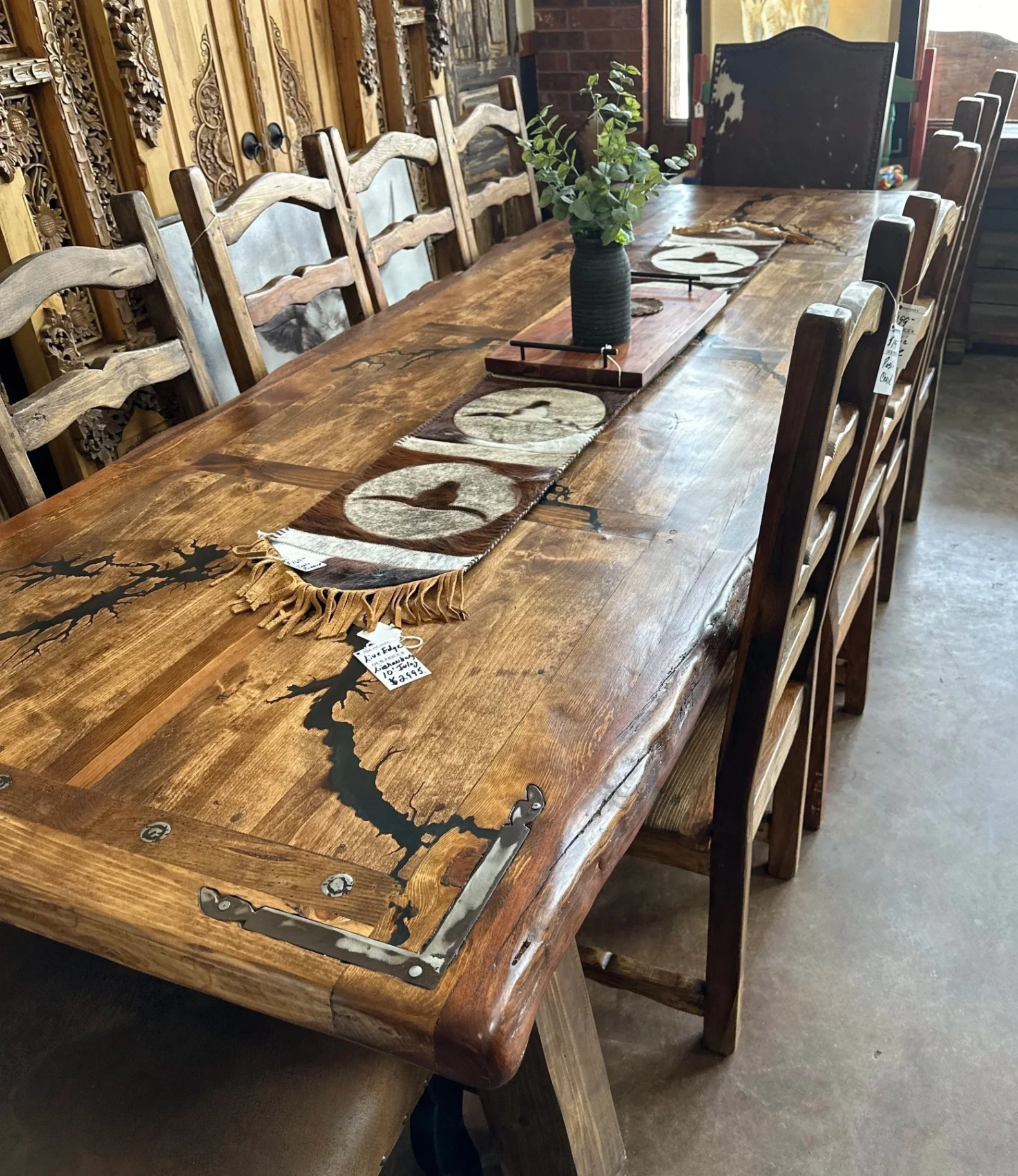 Live-edge fractal-burned dining table with hand-forged iron corner brackets